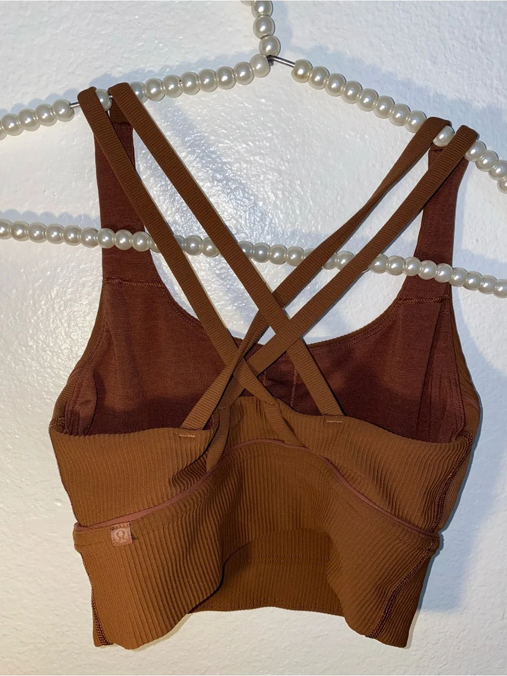 Lululemon brown ribbed sports bra with criss-cross back detail, size 4